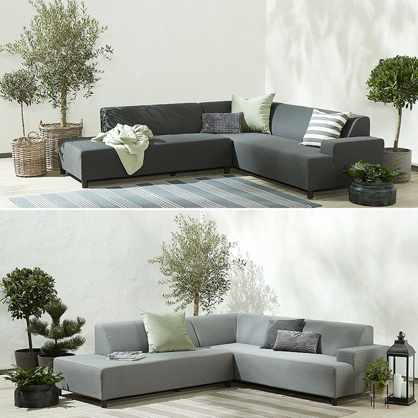 Das UHRE Lounge-Sofa ist in Dunkelgrau und Hellgrau erhältlich Dunkel- und hellgraues Gartensofa auf einer Terrasse